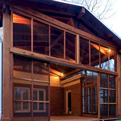 Forever Porch Pavilion (Options: 20' L x 20'-9" W, California Redwood, 2-Post Anchor Kit for High-Wind, No Electrical Wiring Trim, with 2 Fascia Boards for Gutters, 12 ft Posts Height, No Post Decorative Trims, 1 Ceiling Fan Base, No Curtain Rods, with Privacy Panels, Screened Sliding Doors and Fixed Screen Panels, Transparent Premium Sealant). Photo Courtesy of J. Pegg of Cordova, TN.